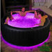 Aurora-6-Person-Hot-Tub-U-AU061-Couples-in-Backyard-with-LEDs-on